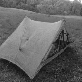 Gravity's tent in a meadow